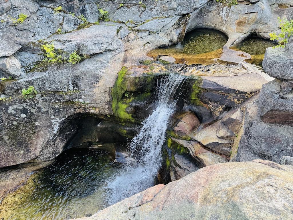 waterfall on green and gray rock-outdoor adventures in Bethel
