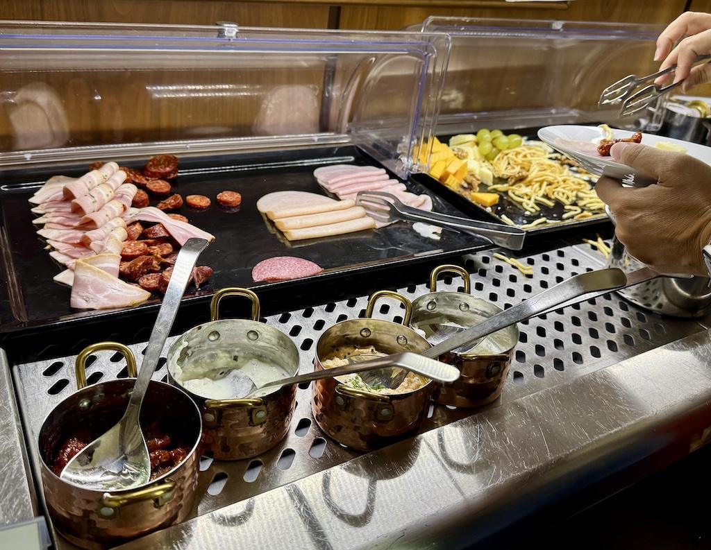 meats, cheeses and fruits on buffet
