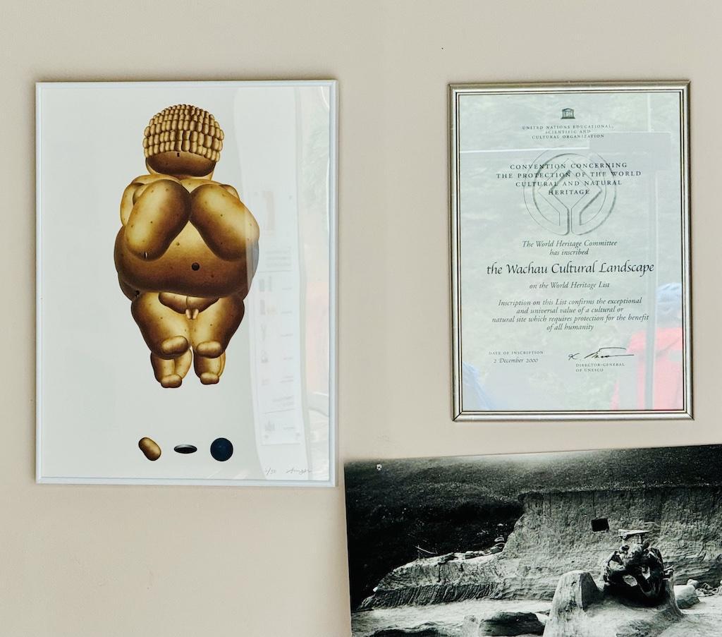 golden statue and framed document